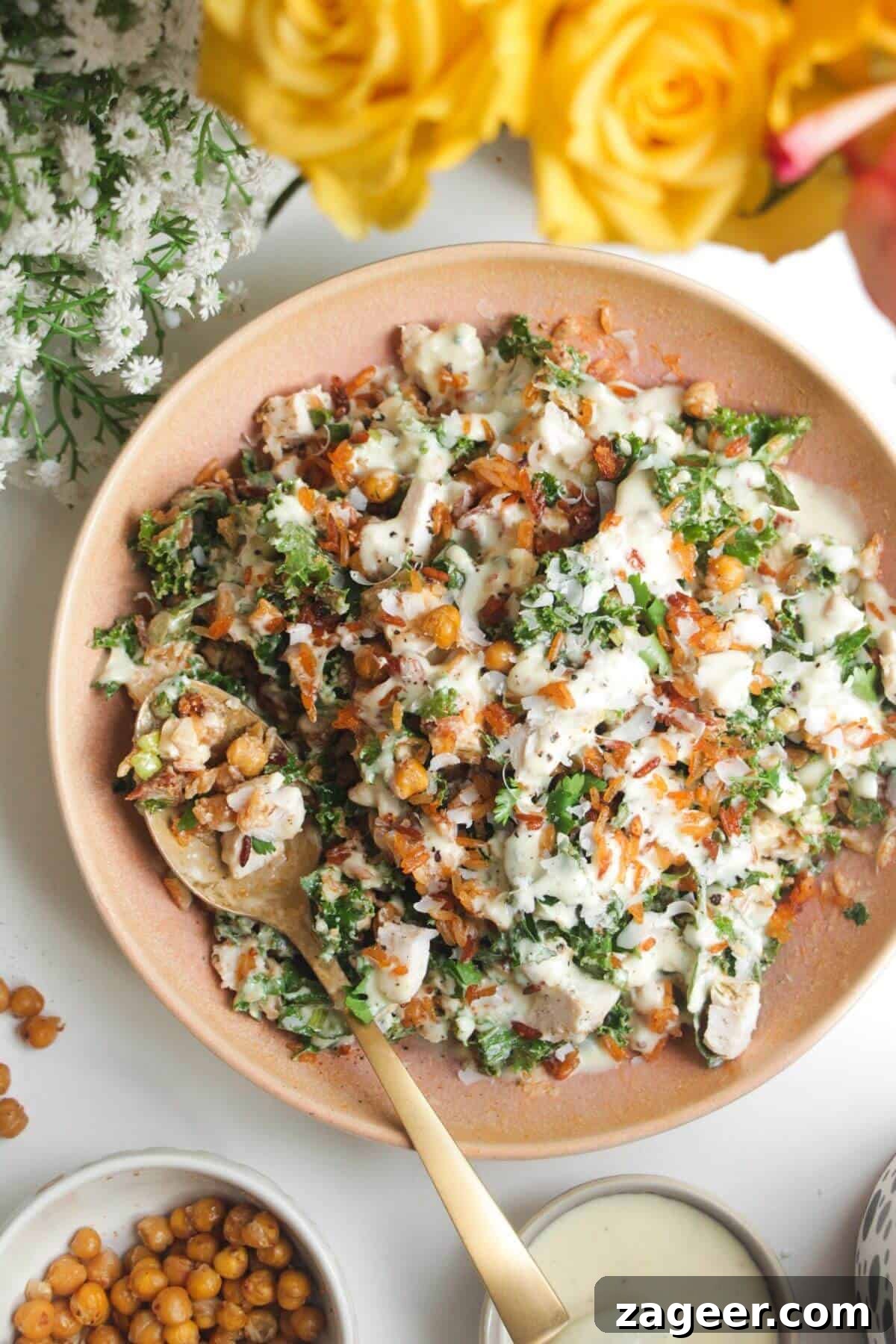 Chicken Caesar Crispy Rice Power Bowl 2 Caesar crispy rice salad in a pink bowl, showcasing its vibrant ingredients.