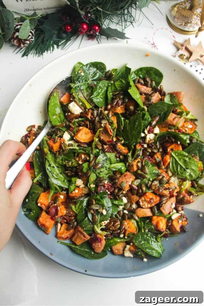 Chicken Caesar Crispy Rice Power Bowl 12 A hearty roasted sweet potato salad served in an elegant white and blue bowl.