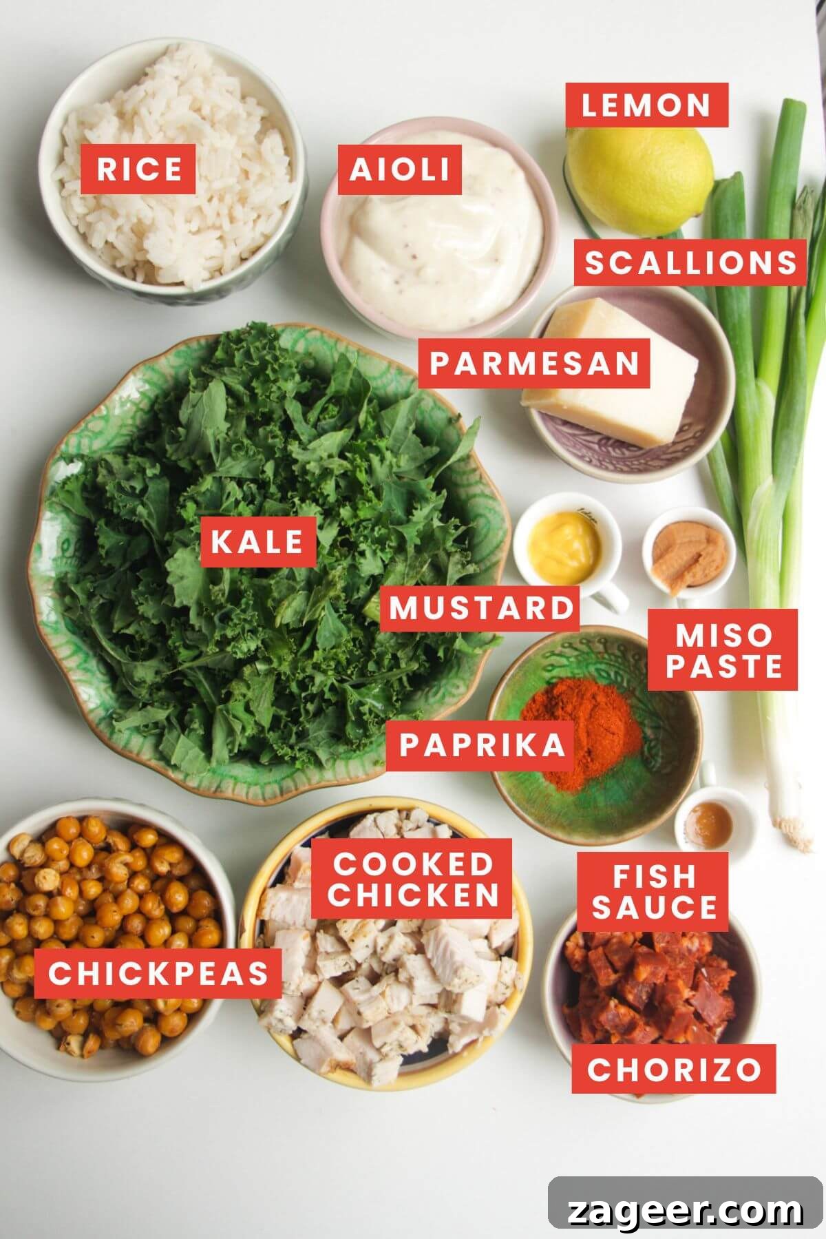 Chicken Caesar Crispy Rice Power Bowl 3 All the fresh ingredients for chicken Caesar rice salad carefully laid out and labeled on a surface.