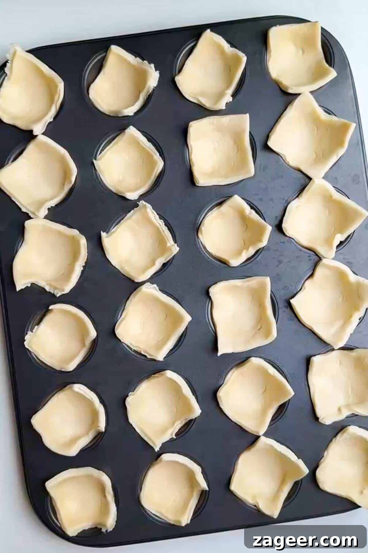 Savory Pesto Ricotta Puff Pastry Bites 6 Puff pastry in a mini muffin pan.