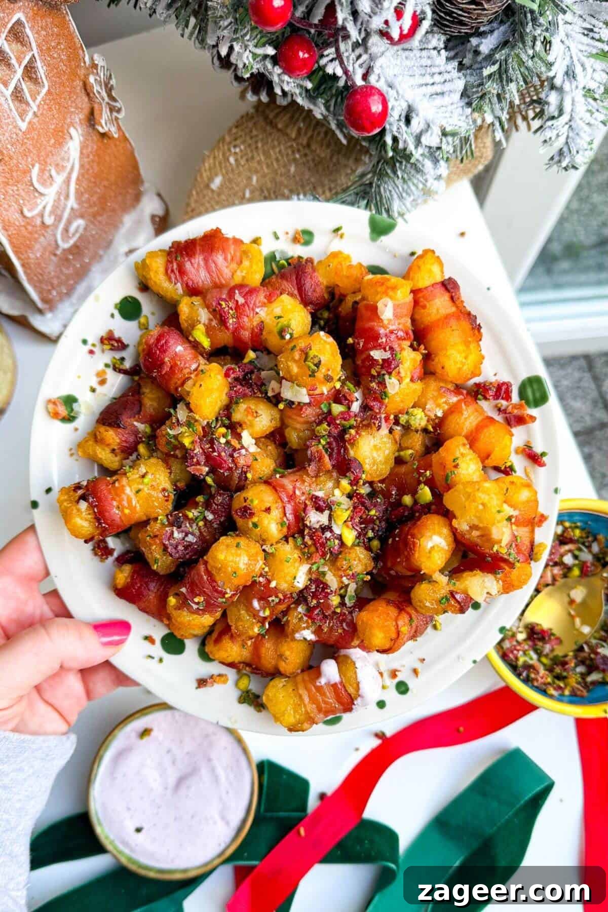 Easy Bacon Wrapped Tots Air Fryer Oven 2 Bacon wrapped tater tots drizzled with honey and nuts on a plate.