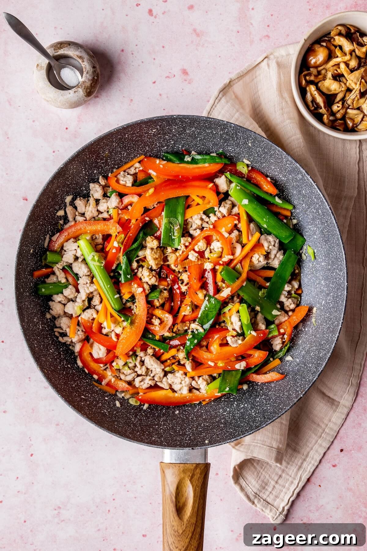 Korean Glass Noodles: A Stir-Fry Sensation 13 Stir frying vegetables with minced garlic