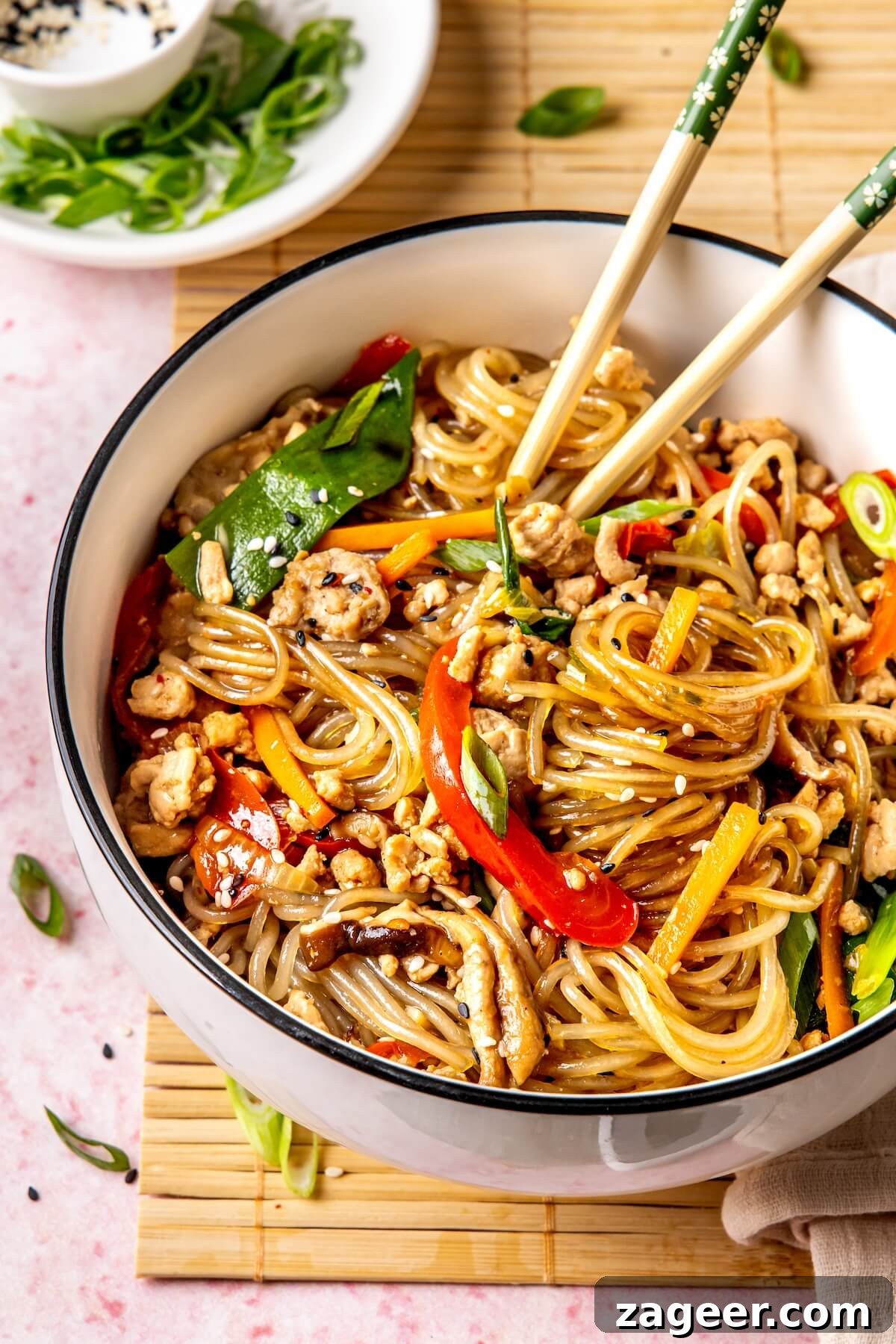 Korean Glass Noodles: A Stir-Fry Sensation 4 Serving of Korean Glass Noodle Stir Fry with chicken