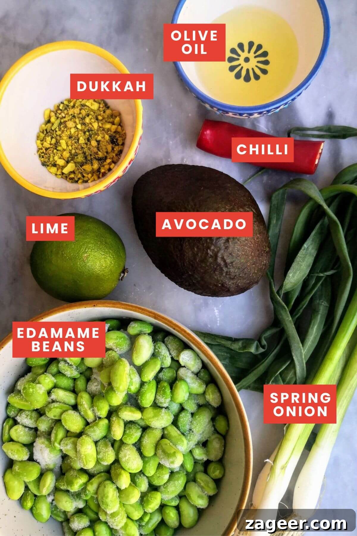 Vibrant Edamame Avocado Hummus 3 Ingredients for edamame hummus with avocado on a grey marble board.