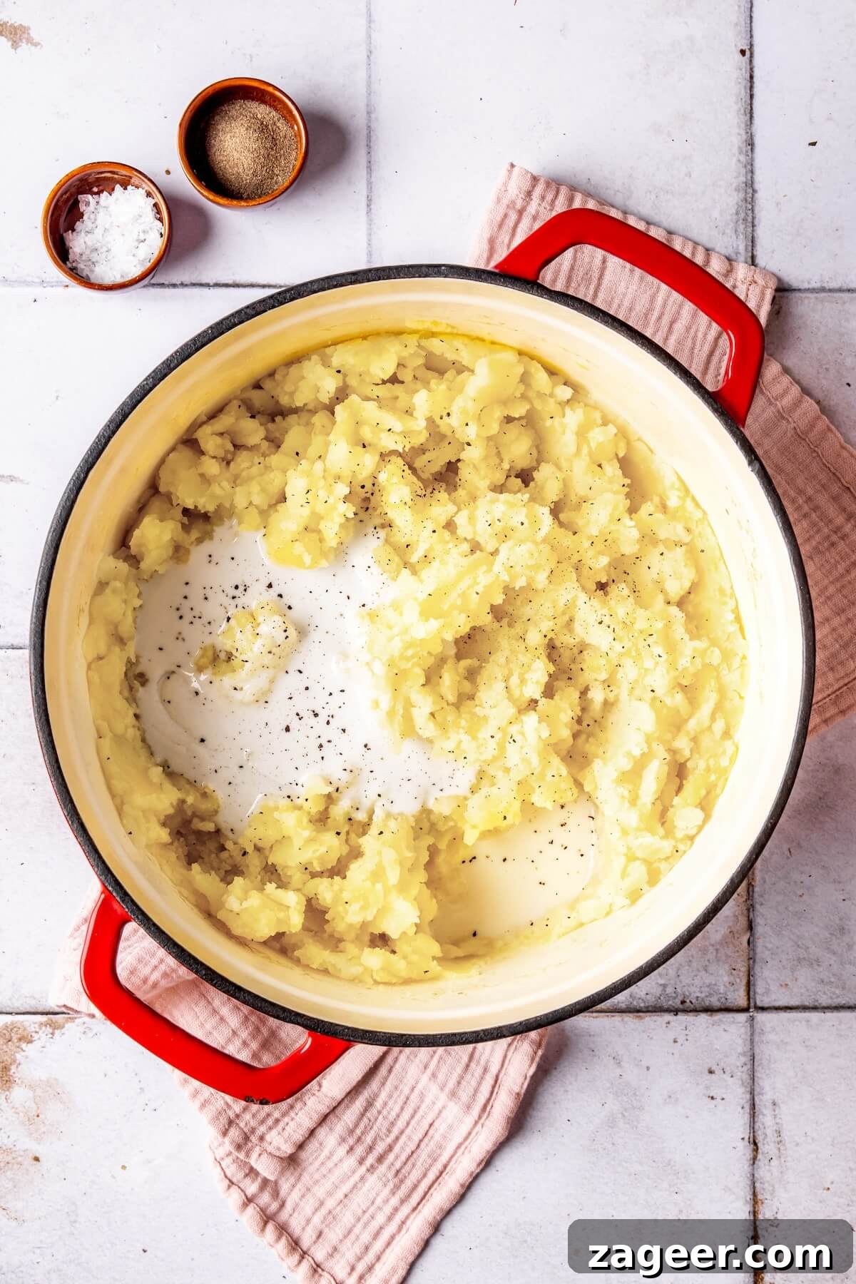 Creamy Dairy-Free Mashed Sweet Potatoes being stirred in a pot