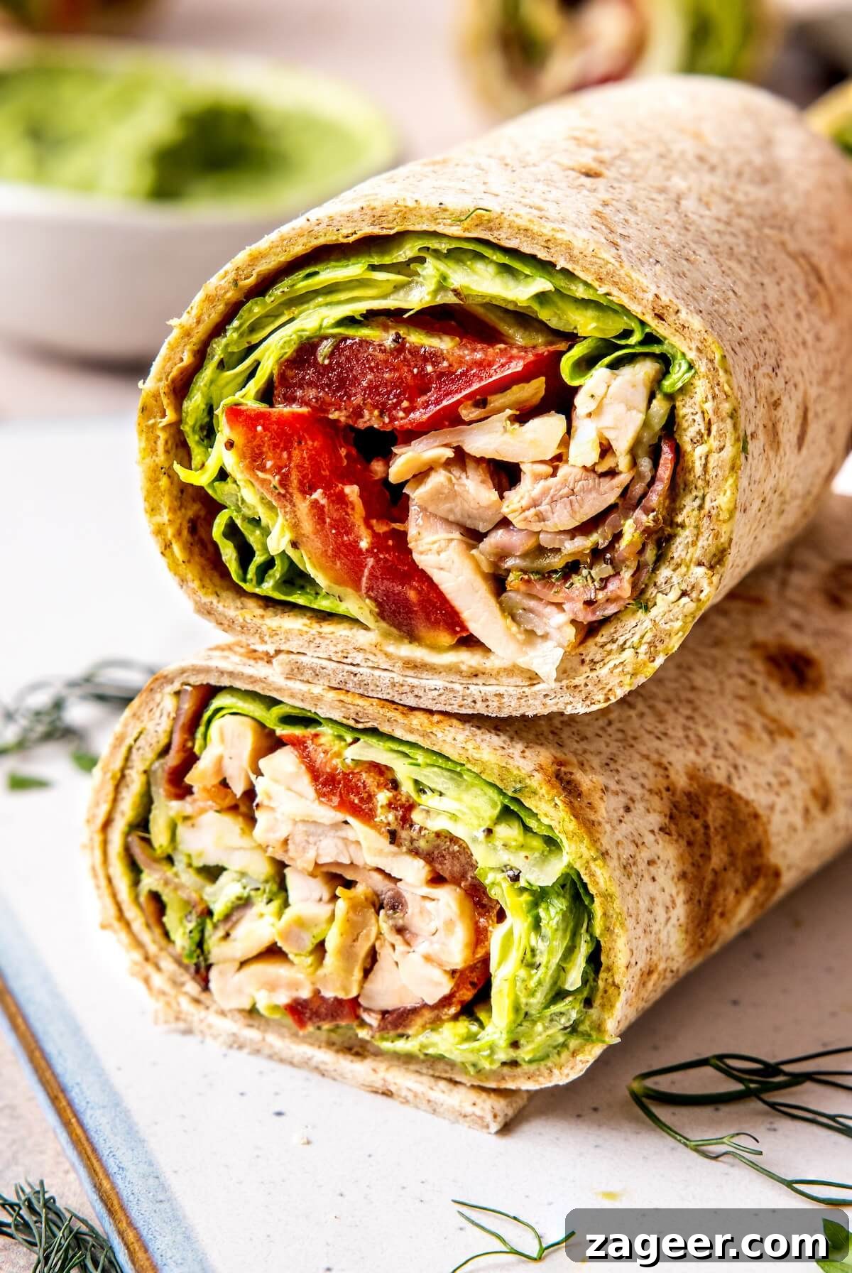 Loaded Green Goddess Chicken Bacon Ranch Wraps 4 Close-up of a Chicken Bacon Green Goddess Ranch Wrap cut in half
