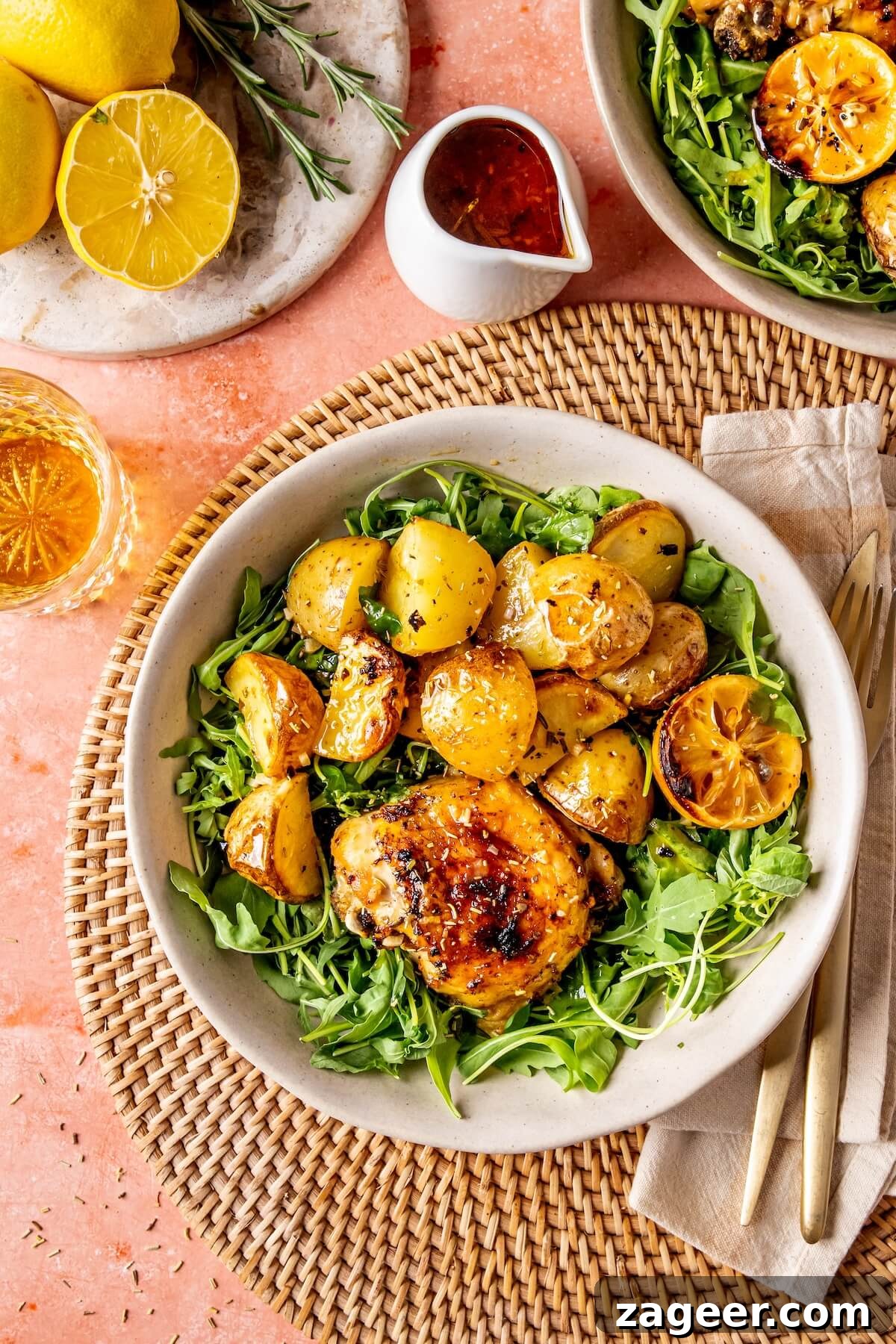 Sheet Pan Lemon Herb Roasted Chicken and Potatoes 3 Close-up of roasted chicken and potatoes with lemon slices