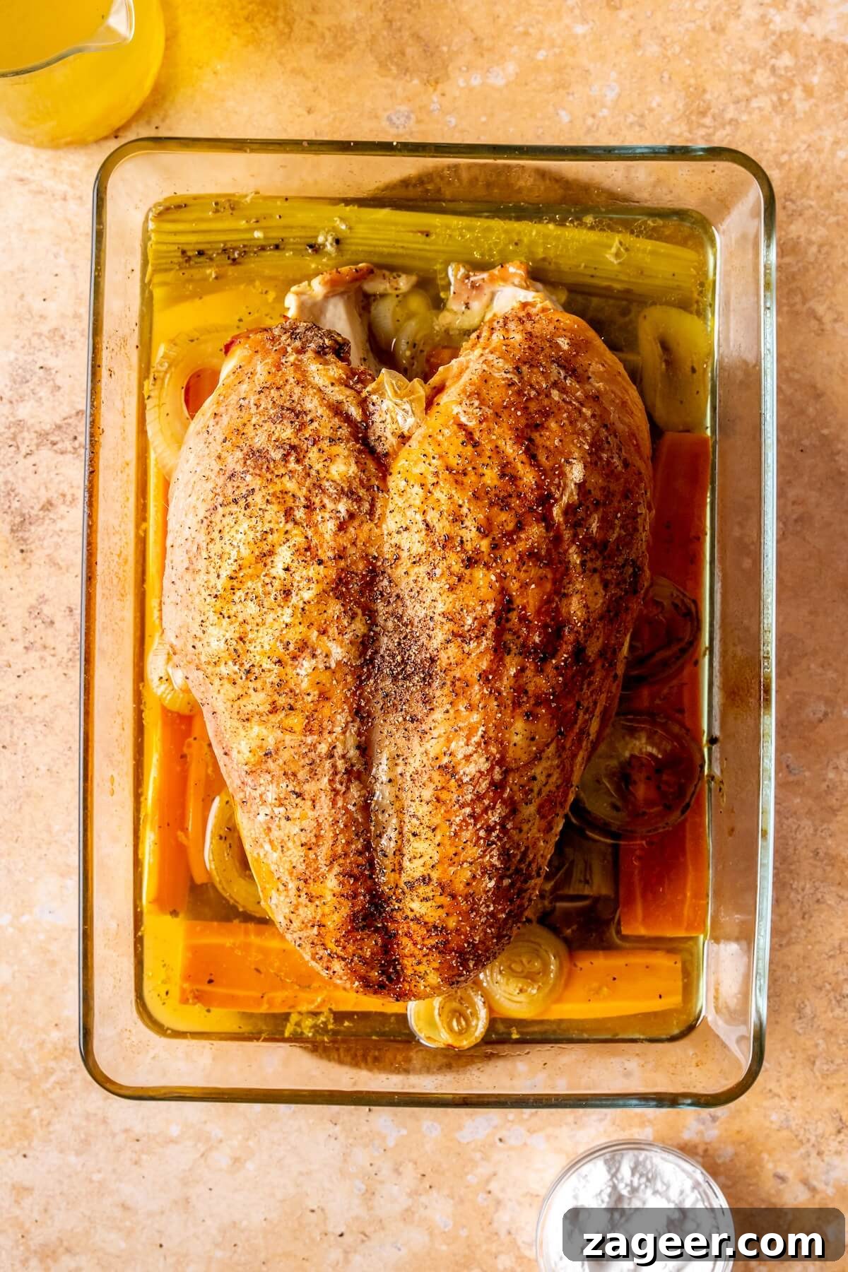 Effortless Oven-Roasted Turkey Breast with Rich Gravy 8 Step 4: Turkey breast roasting in the oven with a meat thermometer