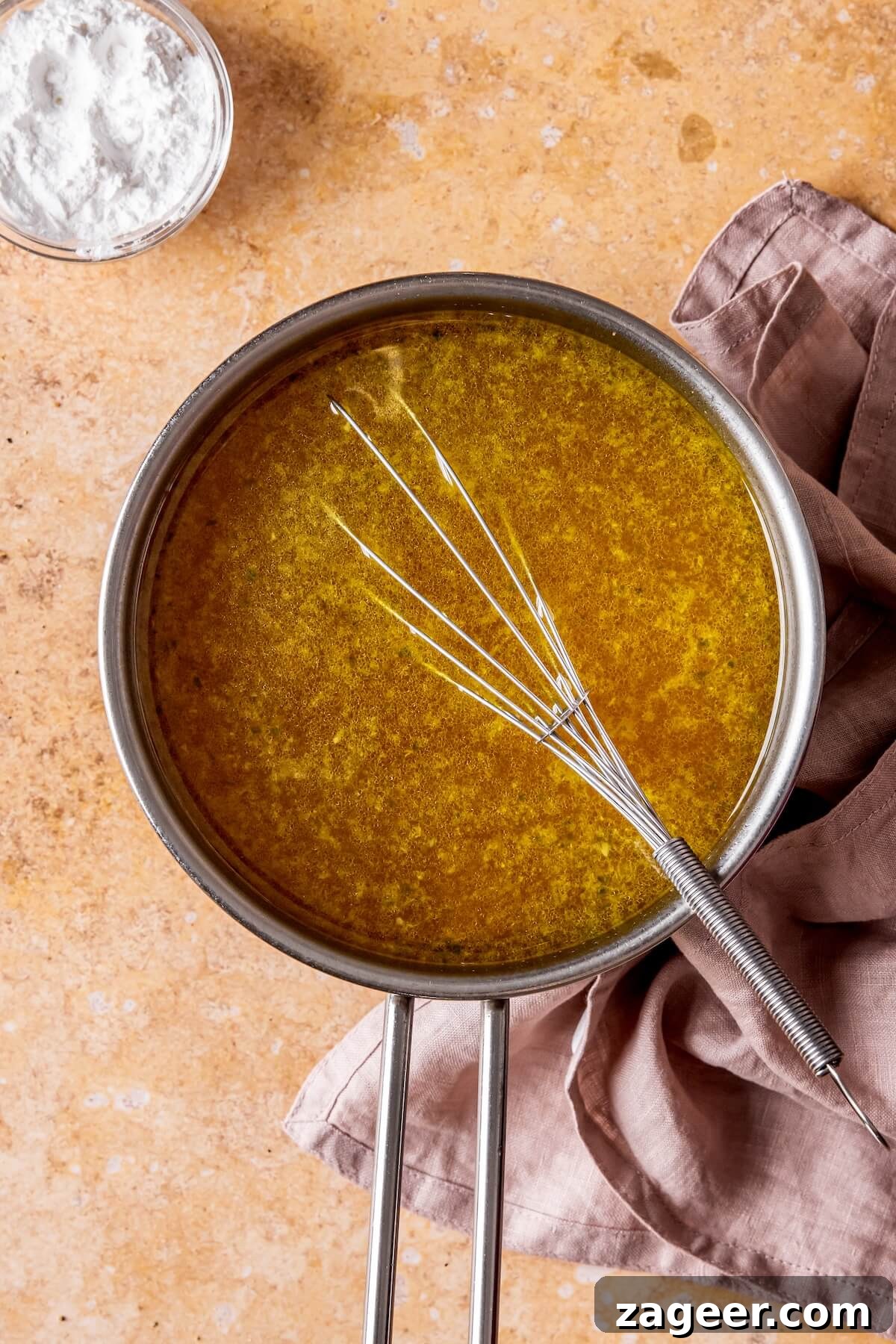 Effortless Oven-Roasted Turkey Breast with Rich Gravy 9 Step 5: Straining pan drippings for gravy preparation