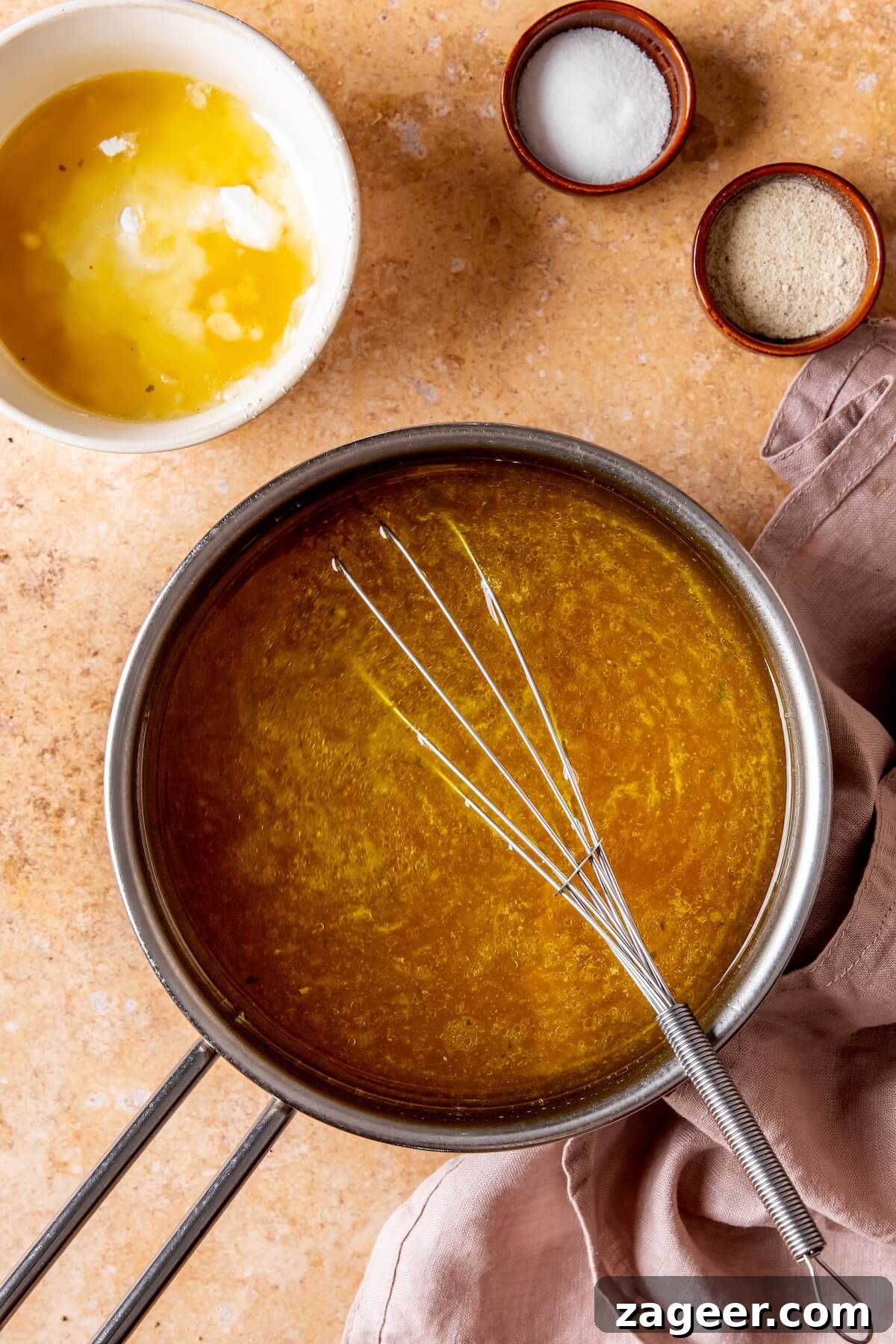 Effortless Oven-Roasted Turkey Breast with Rich Gravy 10 Step 6: Whisking arrowroot slurry into simmering gravy