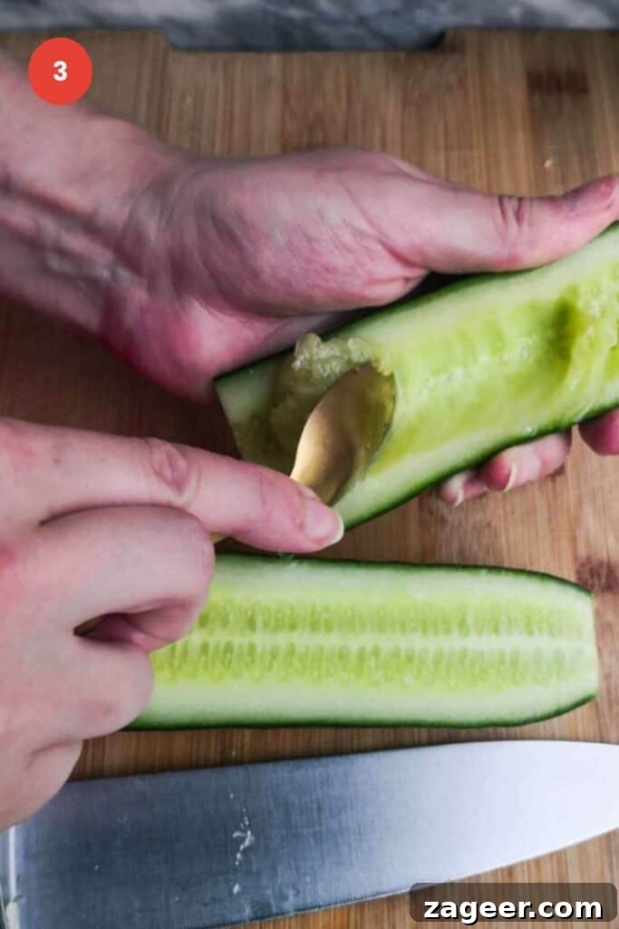 Emerald Goddess Chopped Salad Craze 7 Spoon scooping out cucumber seeds.