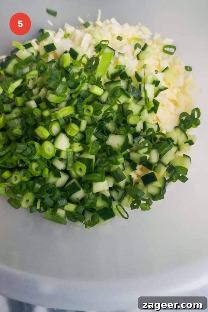 Emerald Goddess Chopped Salad Craze 9 Green goddess salad ingredients in a mixing bowl.