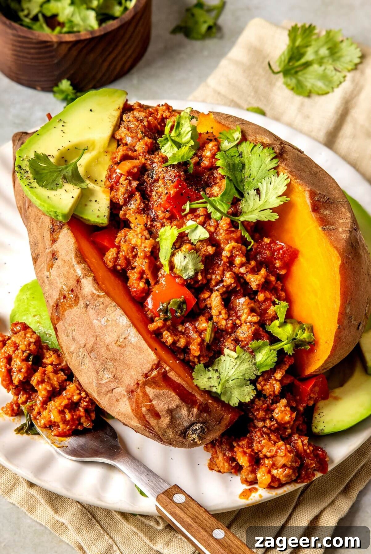 Loaded Chipotle Chorizo Sweet Potatoes 2 Chipotle Chorizo Stuffed Sweet Potatoes - A vibrant, healthy dinner idea featuring bison and avocado.