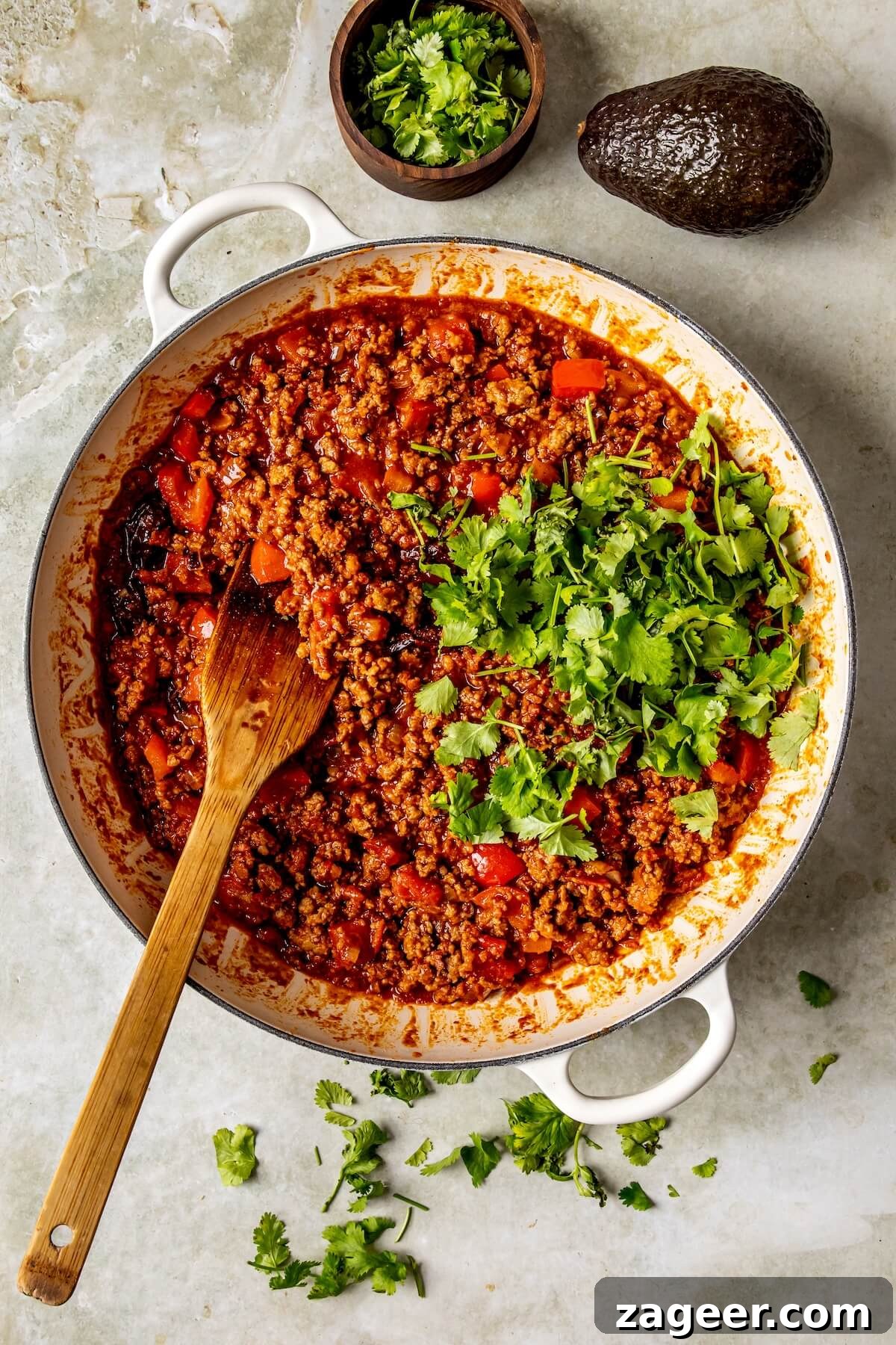 Loaded Chipotle Chorizo Sweet Potatoes 12 Step 5: Generously stuffing the roasted sweet potato halves with the savory meat mixture.