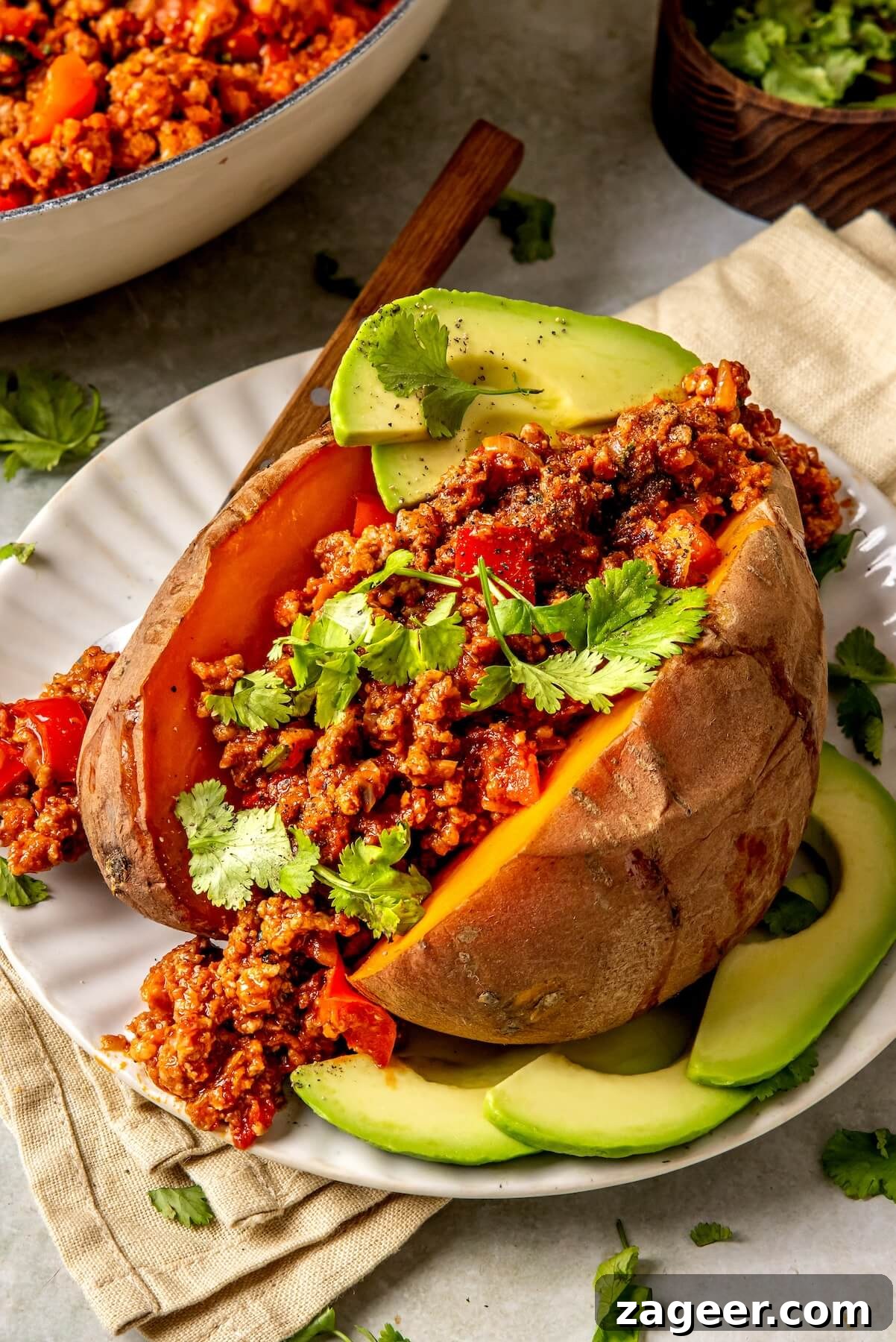 Loaded Chipotle Chorizo Sweet Potatoes 6 Close-up of chipotle peppers in adobo sauce, highlighting their rich color and texture.