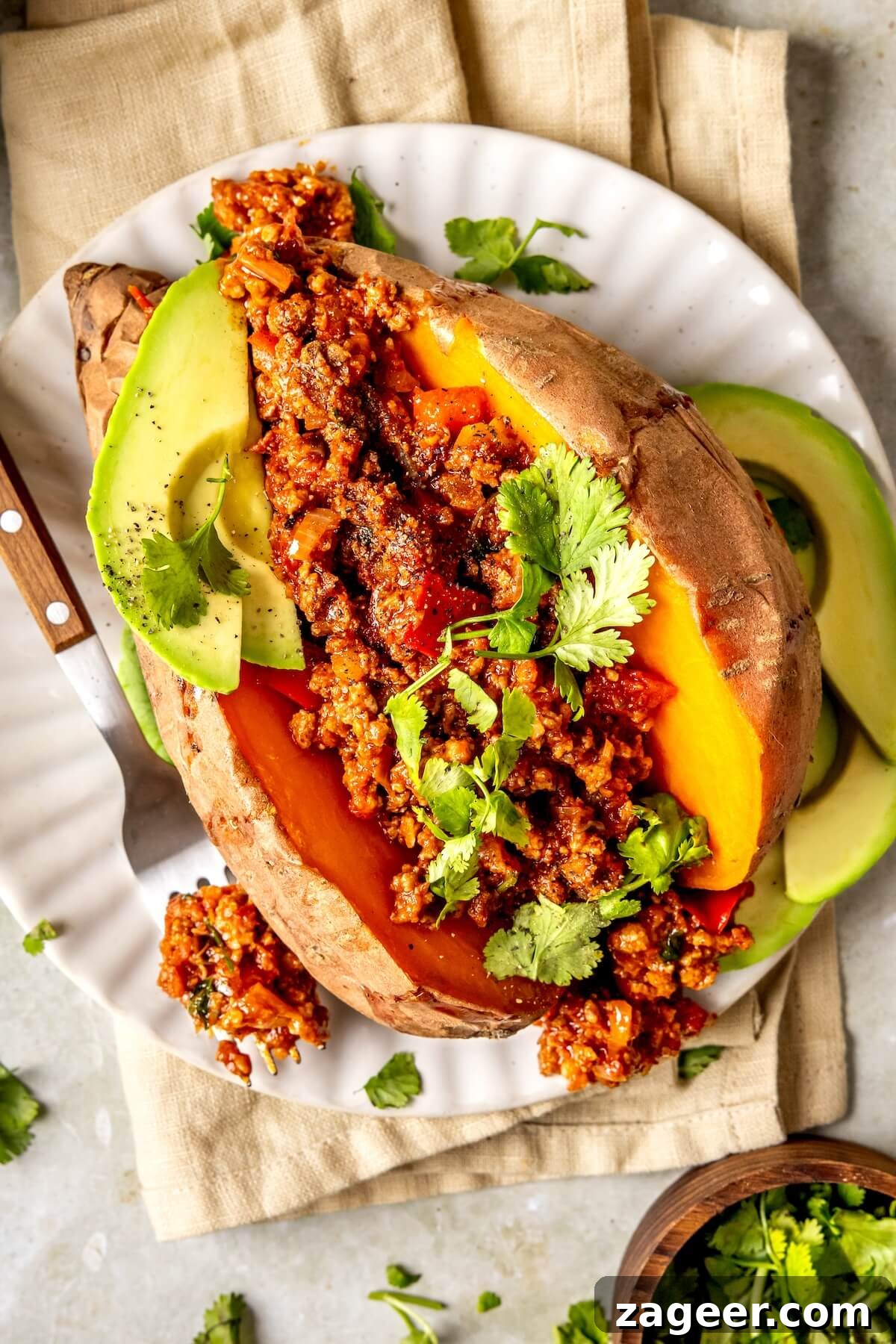 Loaded Chipotle Chorizo Sweet Potatoes 7 Freshly chopped cilantro, ready to be added as a vibrant garnish.