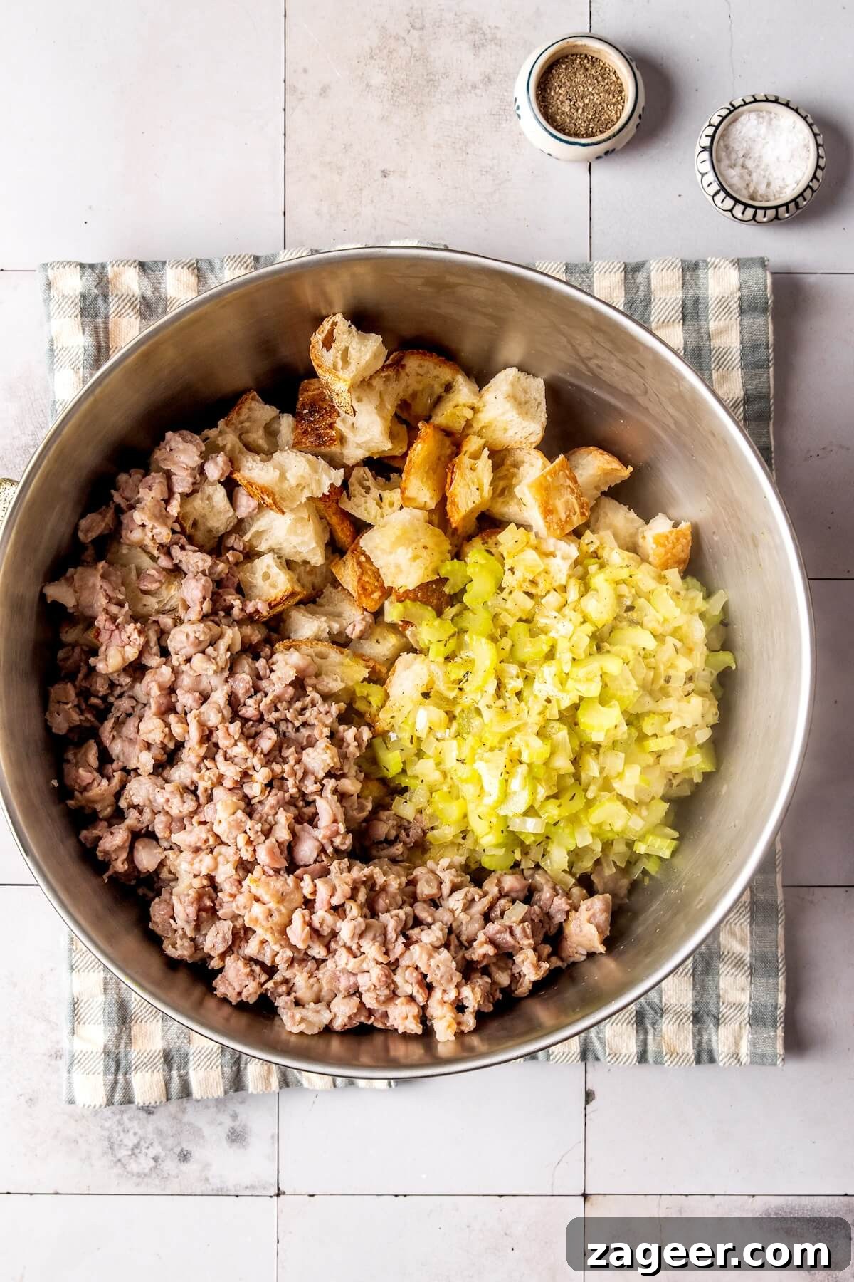 Combining sausage with bread and vegetable mixture