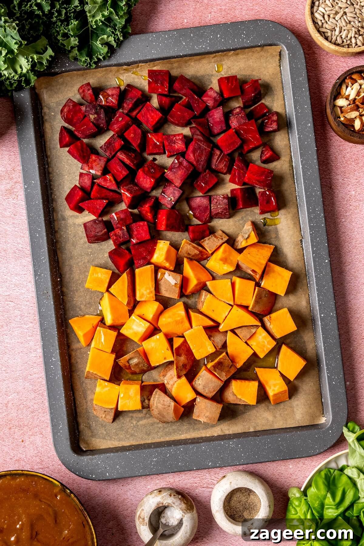 Warm Winter Bounty Salad with Caramelized Shallot Vinaigrette 7 Sweet potatoes, beets, shallots, and garlic on a baking sheet, ready for roasting