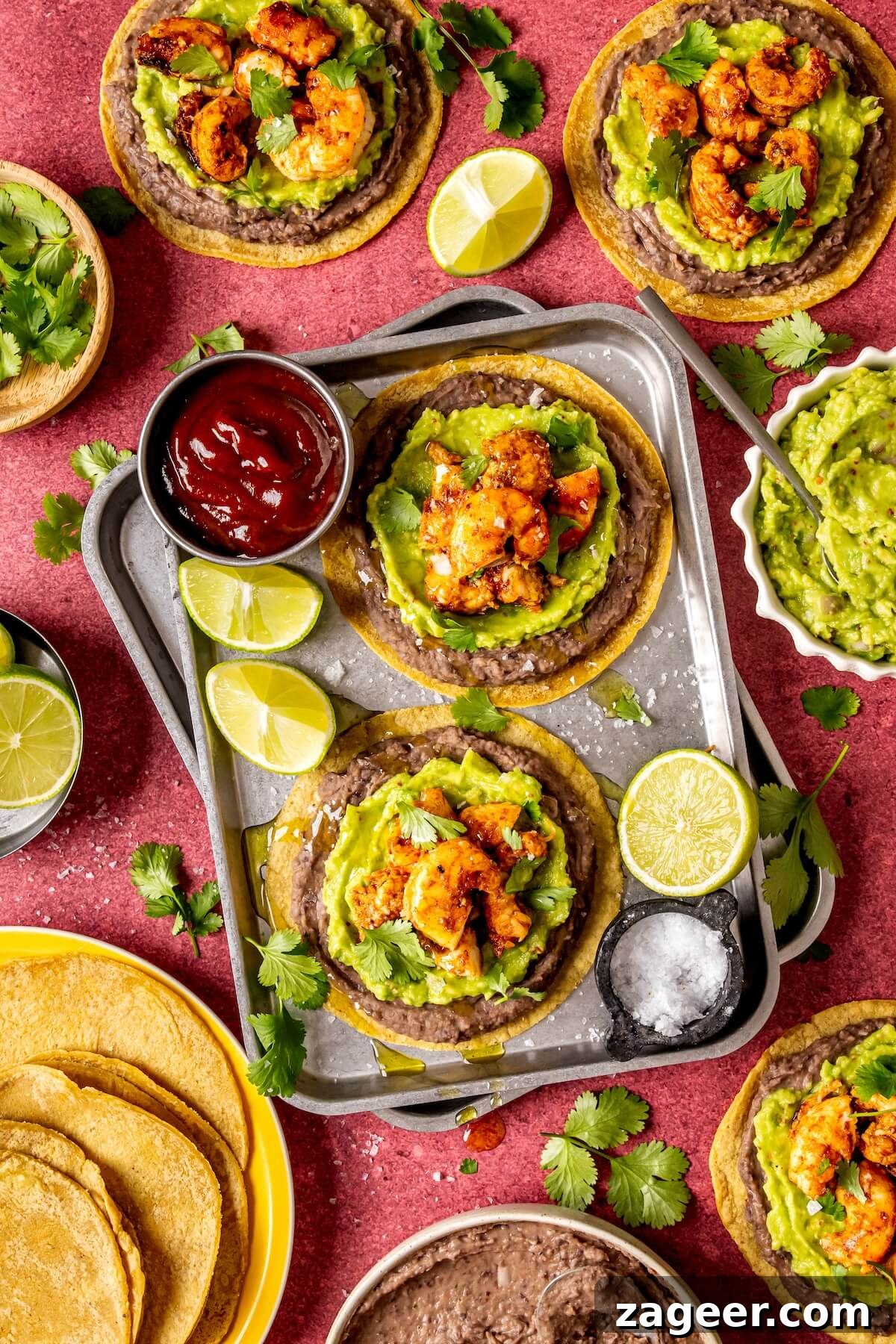 Effortless Shrimp Tostadas 3 Shrimp Tostadas garnished with fresh lime and cilantro, showcasing vibrant colors