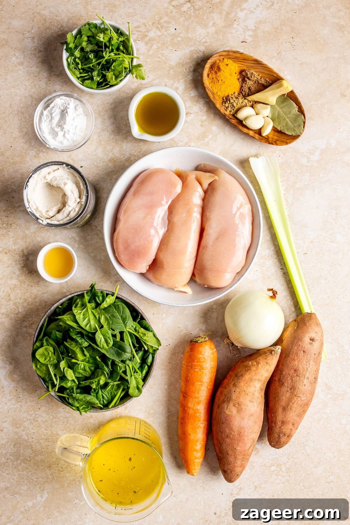 Golden Turmeric Healing Chicken Stew 6 Fresh ingredients for Turmeric Chicken Stew laid out on a table