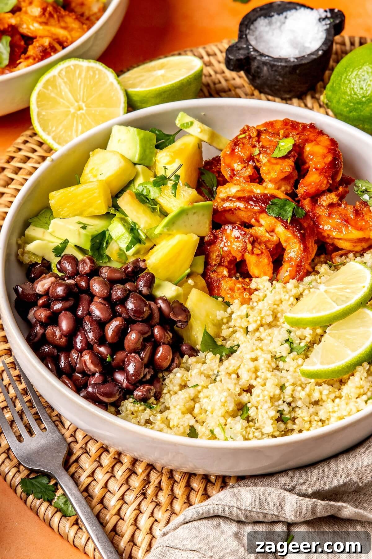 Smoky Shrimp Bowls with Sweet Tropical Salsa 2 Close-up of a Sweet and Smoky Shrimp Bowl with Pineapple Avocado Salsa, highlighting the vibrant colors and textures.