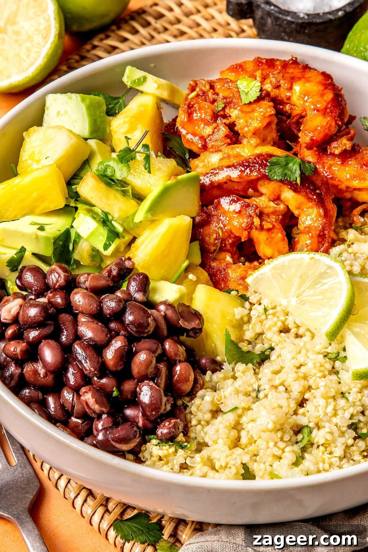 Smoky Shrimp Bowls with Sweet Tropical Salsa 7 A bowl of cooked cilantro lime quinoa, showing its fluffy texture.