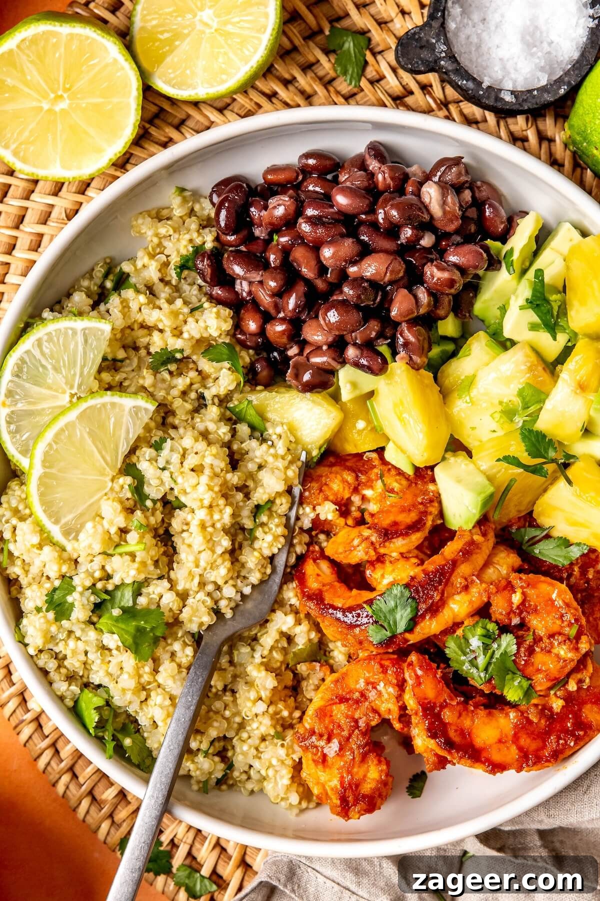 Smoky Shrimp Bowls with Sweet Tropical Salsa 8 Freshly made pineapple avocado salsa in a bowl, featuring diced pineapple, avocado, and chopped cilantro.