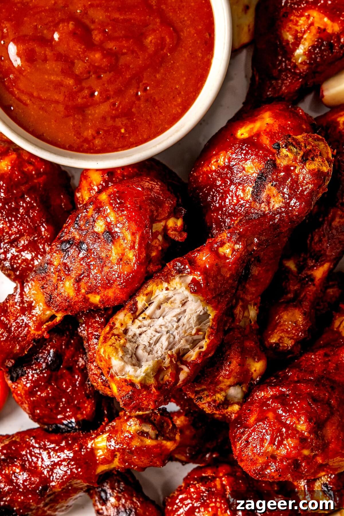 Sweet Peach Glazed Chicken Drumsticks 4 Plated Peach BBQ Sauce Chicken Drumsticks with fresh garnish - Olivia Adriance