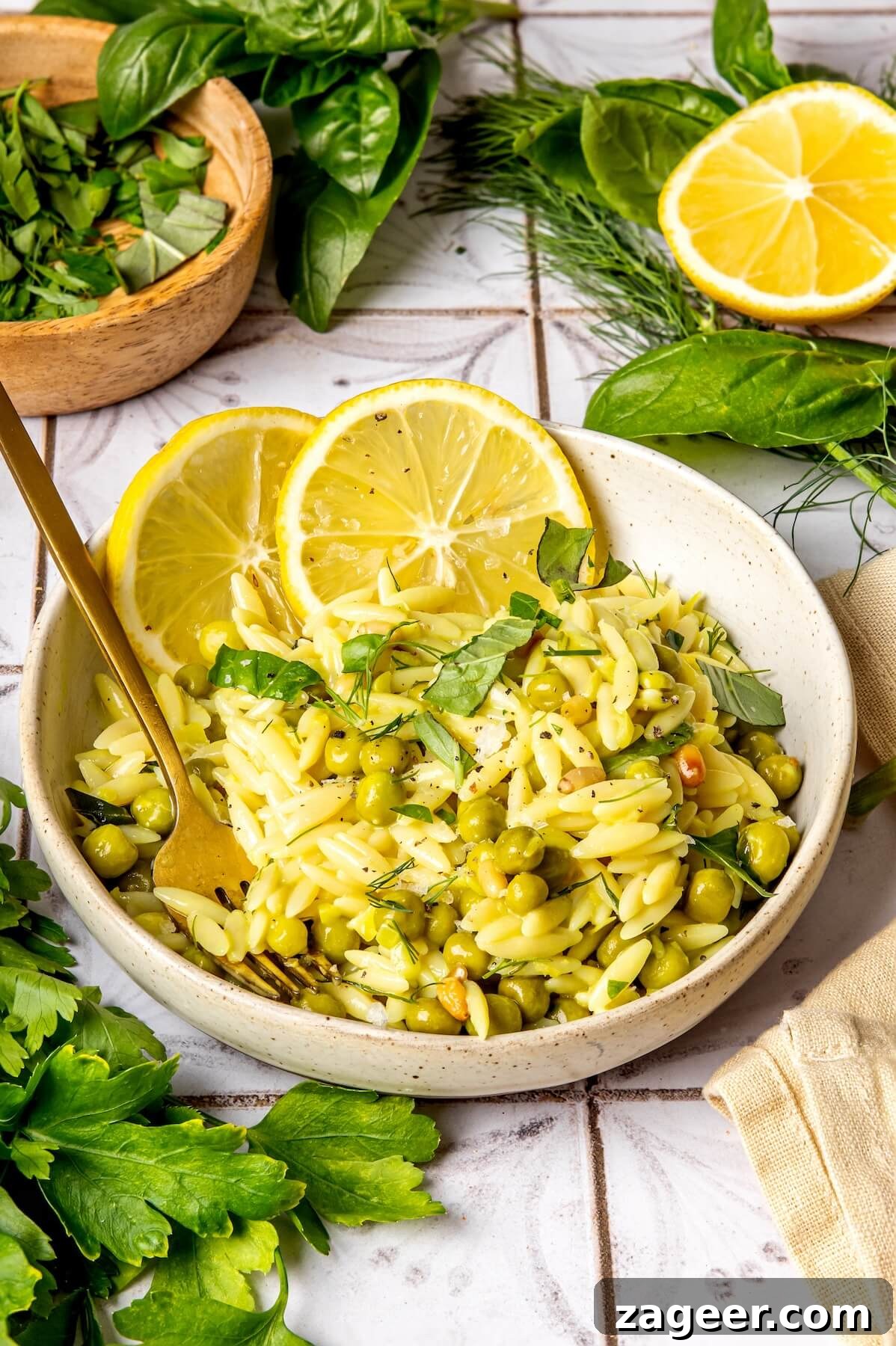 Silky Lemon Orzo (Gluten-Free & Dairy-Free) 4 Close-up of creamy lemon orzo with peas and herbs - Olivia Adriance