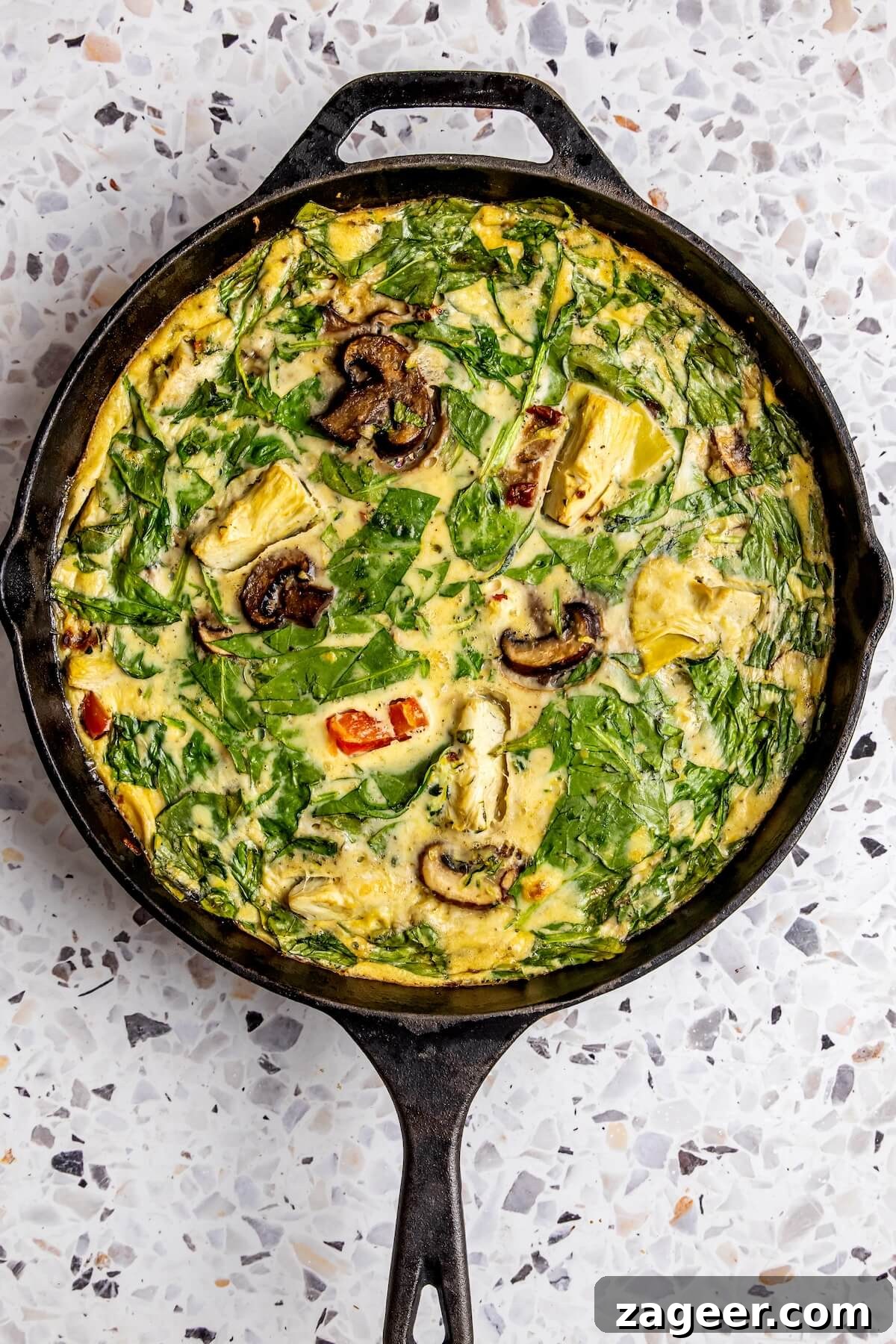 Wholesome Spinach, Mushroom, and Artichoke Frittata 14 A perfectly sliced piece of the dairy-free frittata