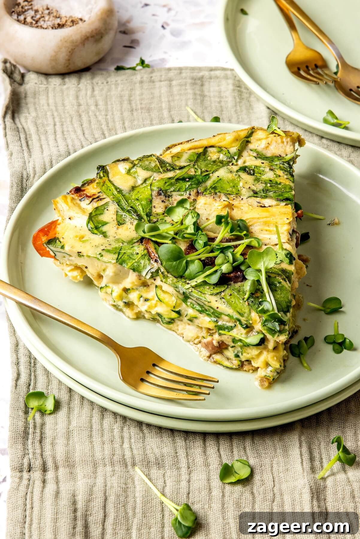 Wholesome Spinach, Mushroom, and Artichoke Frittata 8 Serving a generous portion of spinach mushroom and artichoke frittata