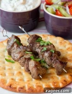 Tender Greek Lamb Souvlaki Skewers 5 An older, less polished photo of Greek Lamb Souvlaki Kebabs on a toasted pita bread, from an earlier version of the recipe.
