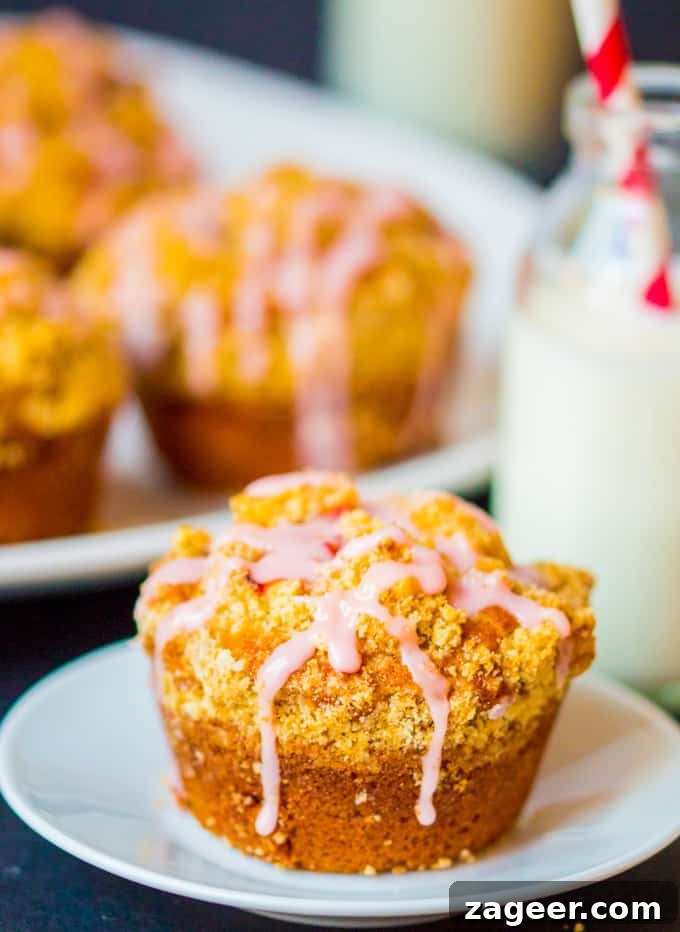 Irresistible Strawberry Crumble Cupcakes 2 Strawberry Streusel cupcakes - Light, fluffy sponge with chunks of juicy strawberry, topped with crunchy streusel and a sweet strawberry drizzle