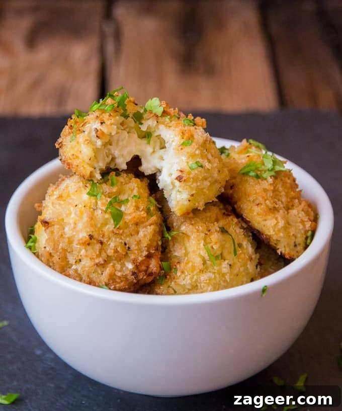 Cauliflower Arancini Delight 2 Cauliflower Arancini filled with creamy boursin cheese. Quicker and healthier than regular arancini. Baked rather than fried.
