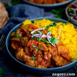 Square image of homemade Chicken Jalfrezi served with fluffy pilau rice.