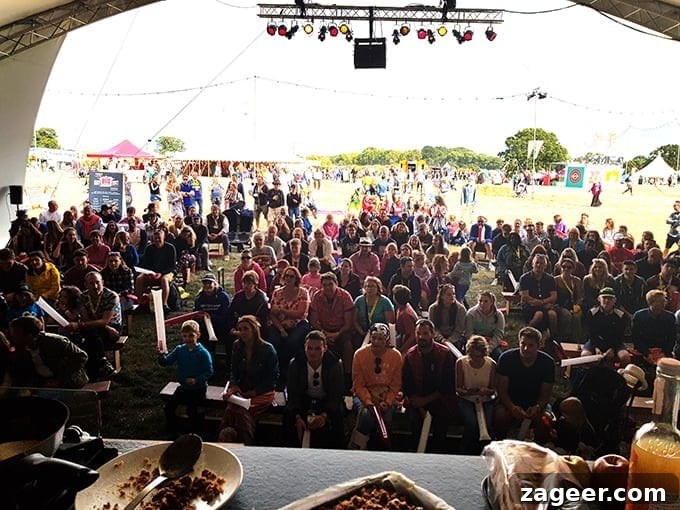Summer's Fade Brew 11 Engaged audience members watching intently at The Big Kitchen during the live cook-off at The Big Feastival