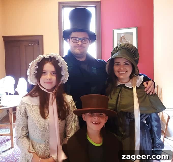 Summer's Fade Brew 6 Family dressed in authentic Victorian clothes, posing playfully at Ironbridge Gorge's Darby Houses