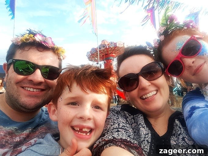 Summer's Fade Brew 8 Nicky and her family, adorned with glitter, enjoying the vibrant atmosphere at The Big Feastival