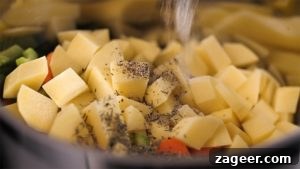 Creamy Chicken Pot Pie Comfort 7 Seasoning vegetables and chicken in a pan for pot pie soup