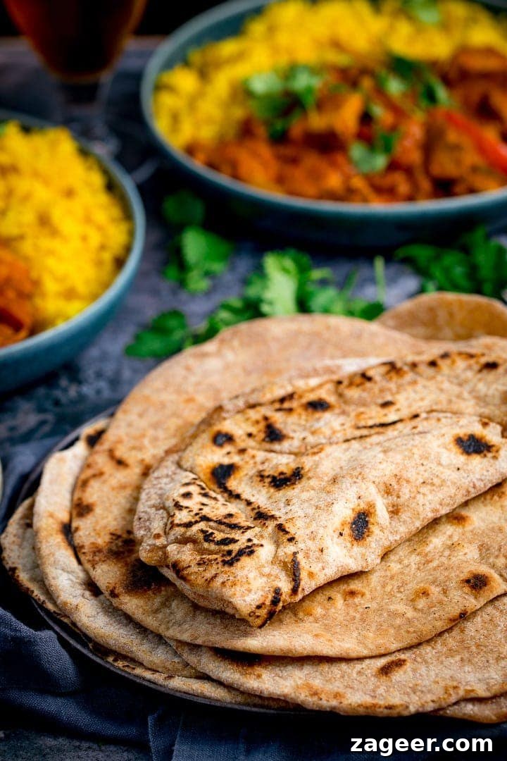 Perfect Homemade Chapati 7 A close-up shot of several warm, soft chapatis stacked on a plate, ready to be enjoyed with a meal.
