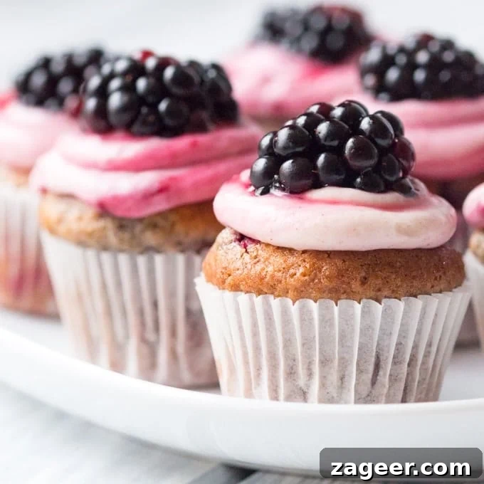 Autumn Spiced Blackberry Poppers 3 Blackberry Spice Muffin Bites - Sweet little muffin bites made with mixed spices and topped with a ginger and blackberry frosting.