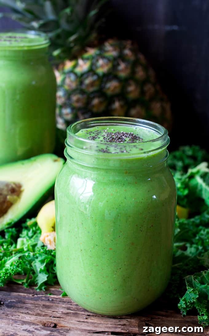 Pineapple Avocado Bliss Smoothie 2 Creamy Pineapple Avocado Feel Good Smoothie garnished with almonds and chia seeds, rich in healthy ingredients for breakfast.