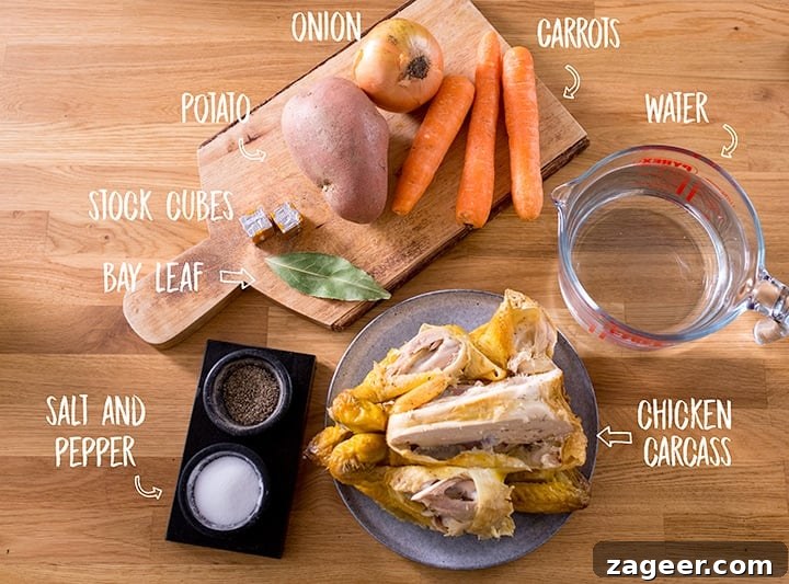 Hearty Loaded Chicken Vegetable Soup 4 A rustic wooden background featuring a selection of fresh ingredients: chicken carcass, carrots, onion, potatoes, and a bay leaf, essential for making homemade chicken soup.