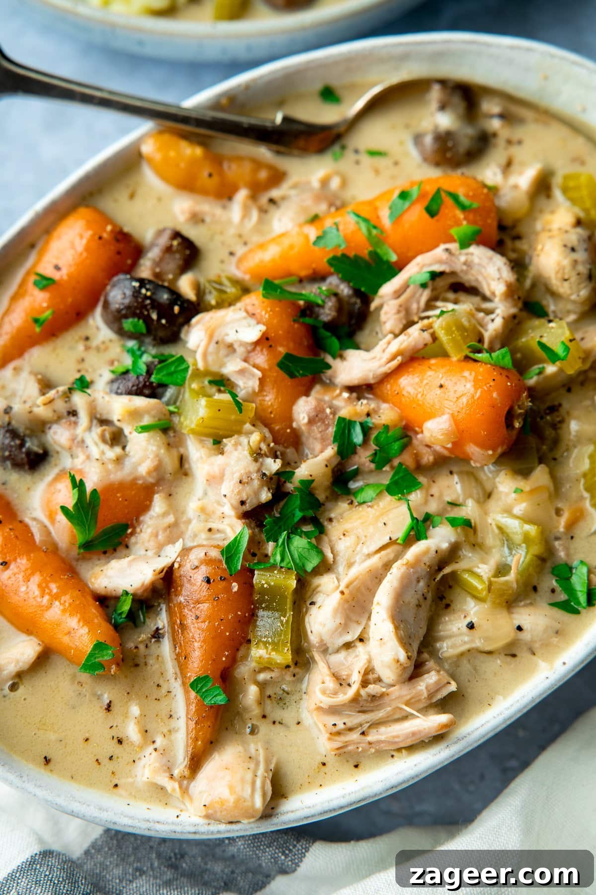 Creamy Chicken Casserole Serving A white serving dish generously filled with a creamy chicken casserole, ready to be served.
