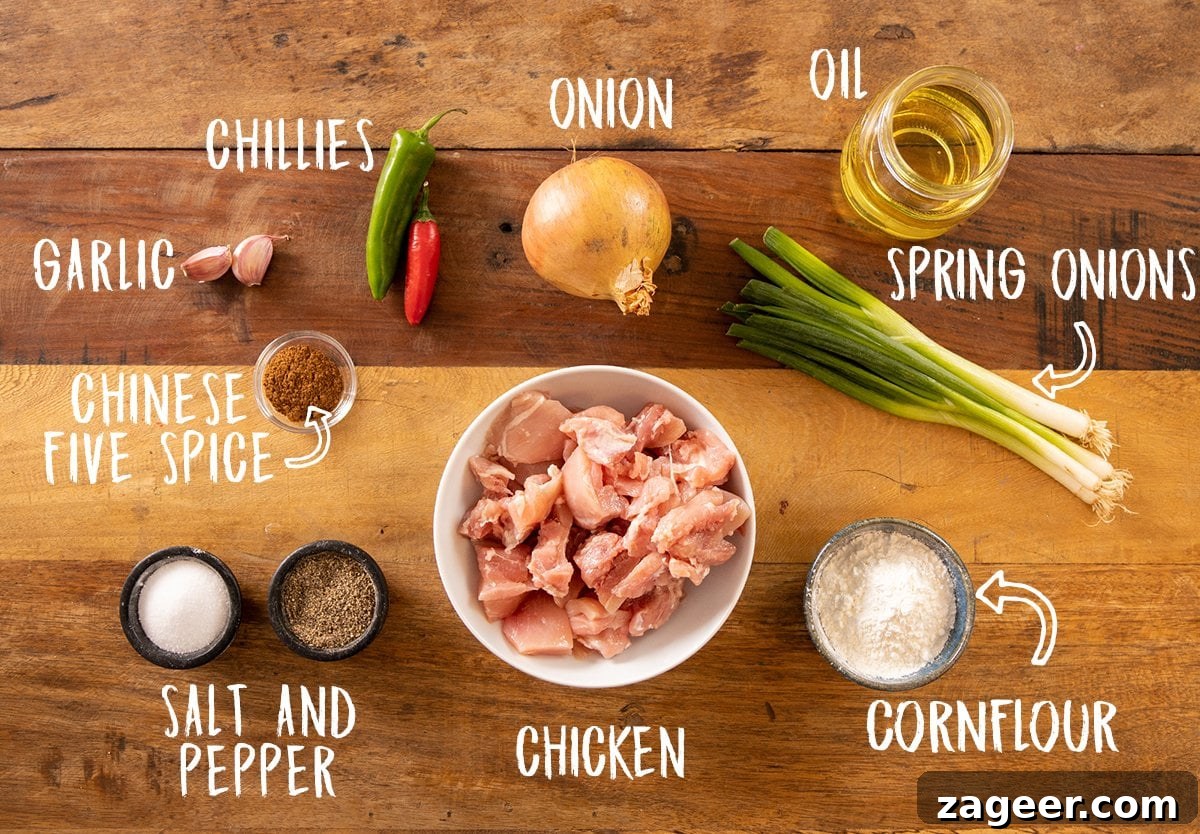 Crispy Salt and Pepper Chicken Bites 3 Ingredients for salt and pepper chicken on a wooden table