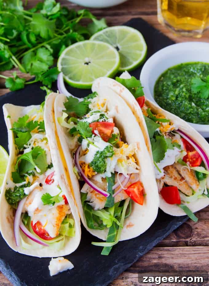 Morro Bay's Fresh Catch Tacos 2 Fish Tacos with a mountain of toppings and TWO sauces - A garlic Mexican crema and a hot green chilli salsa!