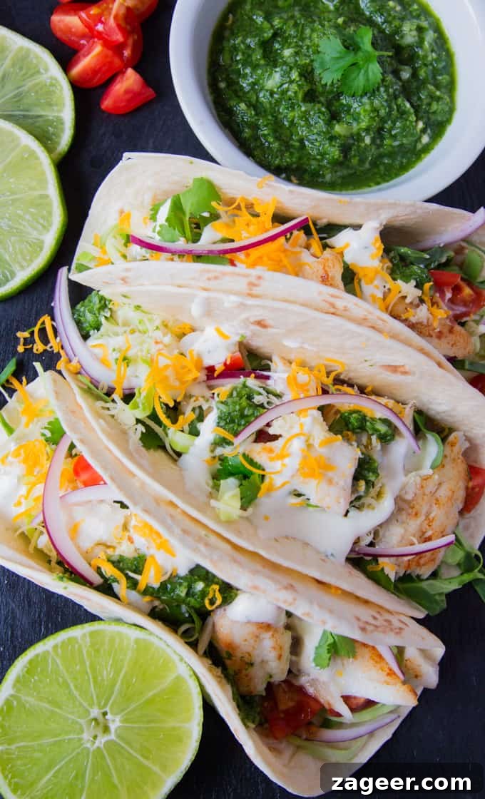 Morro Bay's Fresh Catch Tacos 4 Fish Tacos with a mountain of toppings and TWO sauces - A garlic Mexican crema and a hot green chilli salsa!