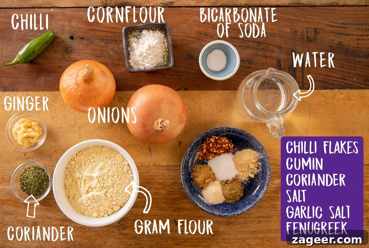 Crispy Golden Onion Bhaji 3 Ingredients for onion bhaji laid out on a rustic wooden table, including sliced onions, spices, gram flour, and oil.
