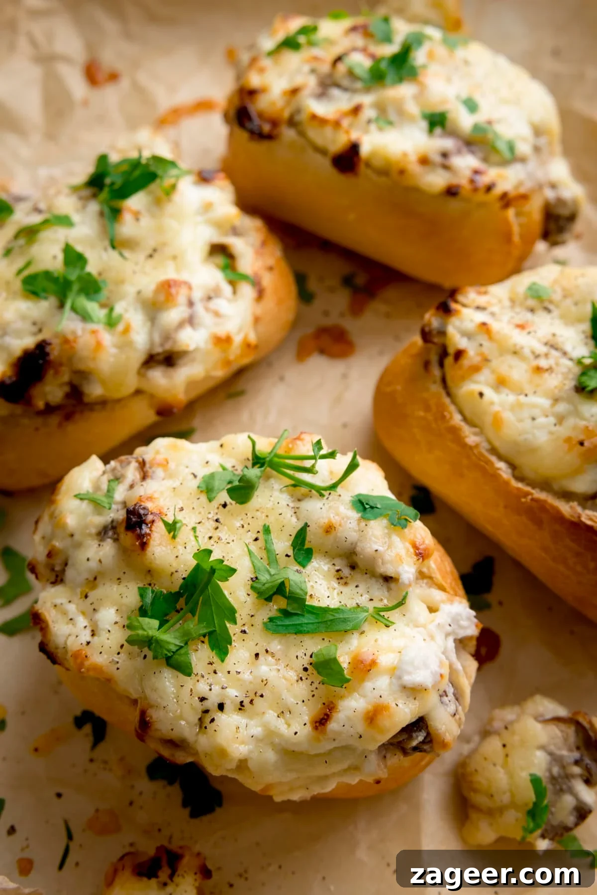 Luscious Creamy Garlic Mushroom Stuffed Rolls 2 Close up of Cheesy Mushroom Stuffed Garlic Breads topped with parsley.