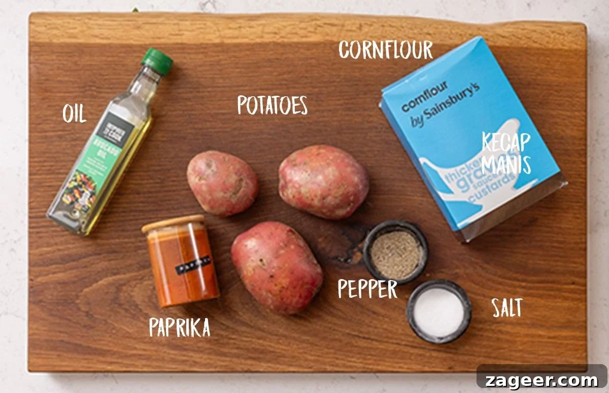 Perfectly Crispy Air Fryer Potato Chips 4 A selection of ingredients for making air fryer chips, including raw potatoes, a bowl of cornflour, a bottle of cooking oil, and small bowls of salt, pepper, and paprika, all arranged on a rustic wooden board.